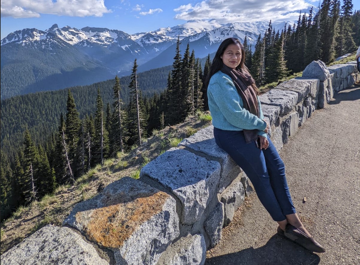 There is a pic of Siddhi Mittal with mountains at back